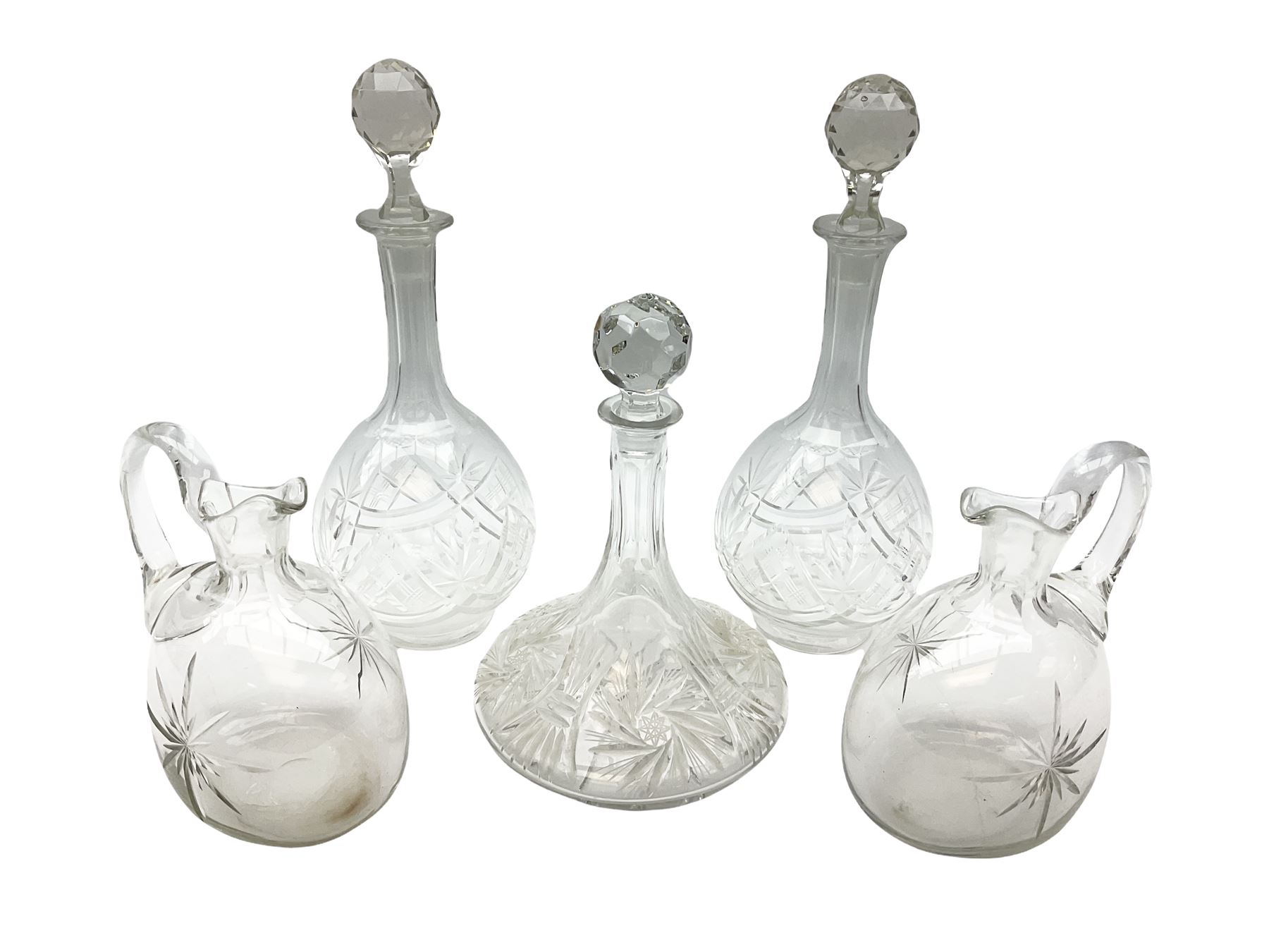 Pair of cut glass decanters and stoppers, together with a cut glass ships decanter and stopper, and pair of claret jugs with star cut decoration to bodies, in one box, (5)