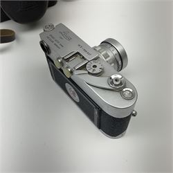 Leica M3 camera body, 1959, chrome finish, serial number '986937', fitted with 'Ernst Leitz GmbH Wetzlar Summicron f=5cm 1:2 Nr.1592614' lens, with Leica M3 instruction booklet