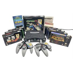 Nintendo 64 console, two controllers, games and accessories. Accessories to include the ‘Tremorpak’ and ‘Spook’ 2 Phono plugs and a S-VHS plug with adapter, both in original boxes. Games to include ‘Golden Eye 007’, ‘Doom 64’, ‘Killer Instinct Gold’, ‘Tetrisphere’, ‘F-1 World Grand Prix’, ‘Pilotwings 64’ and ‘Lylatwars’ with ‘Rumble Pak’, all with original boxes and instruction manuals. ‘Star Wars Episode I Racer’ game cartridge in Shadows of the Empire box. 
