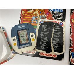 Collection of retro handheld games, including Nintendo Game & Watch ‘Snoopy Tennis’ (1982) and ‘Squish’ (1986) both with instruction booklets, Casio CG-600 ‘Star Invader’ with box, 3 in 1 LCD cartridge game including ‘Soccer’, ‘Invader’ and ‘Bomb Finder’ games, and two Grandstand ‘Pinball Wizard’ (1988) games, both with original boxes
