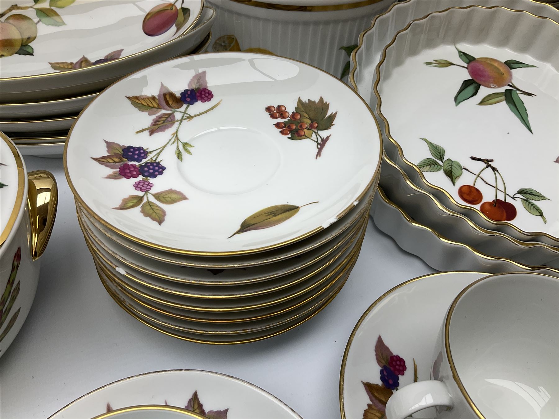 Royal Worcester Evesham pattern dinner and tea wares, comprising five tureens, seven coffee cup, ten tea cups and saucers, coffee pot, jug and various serving bowls etc, along with Royal Worcester Pastorale pattern tea ware, including ten cups and saucers, ten side plates etc.  .