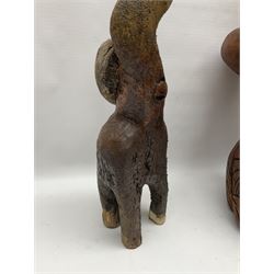 Helen Skelton (British 1933 – 2023): Three carved wooden abstract sculptures, each modelled as a cat, with carved or painted features, largest H63cm. Born into an RAF family in 1933 in Kent and travelled the world extensively during her childhood. After settling in Bridlington, Helen immersed herself in painting, textiles, and wood sculpture, often inspired by nature's beauty. Her talent was showcased in a one-woman show at Sewerby Hall and recognised with the sculpture prize at Ferens Art Gallery in 2000. Sadly, Helen’s daughter passed away from cancer in 2005. This loss inspired Helen to donate her sculptures to Marie Curie upon her passing in 2023.