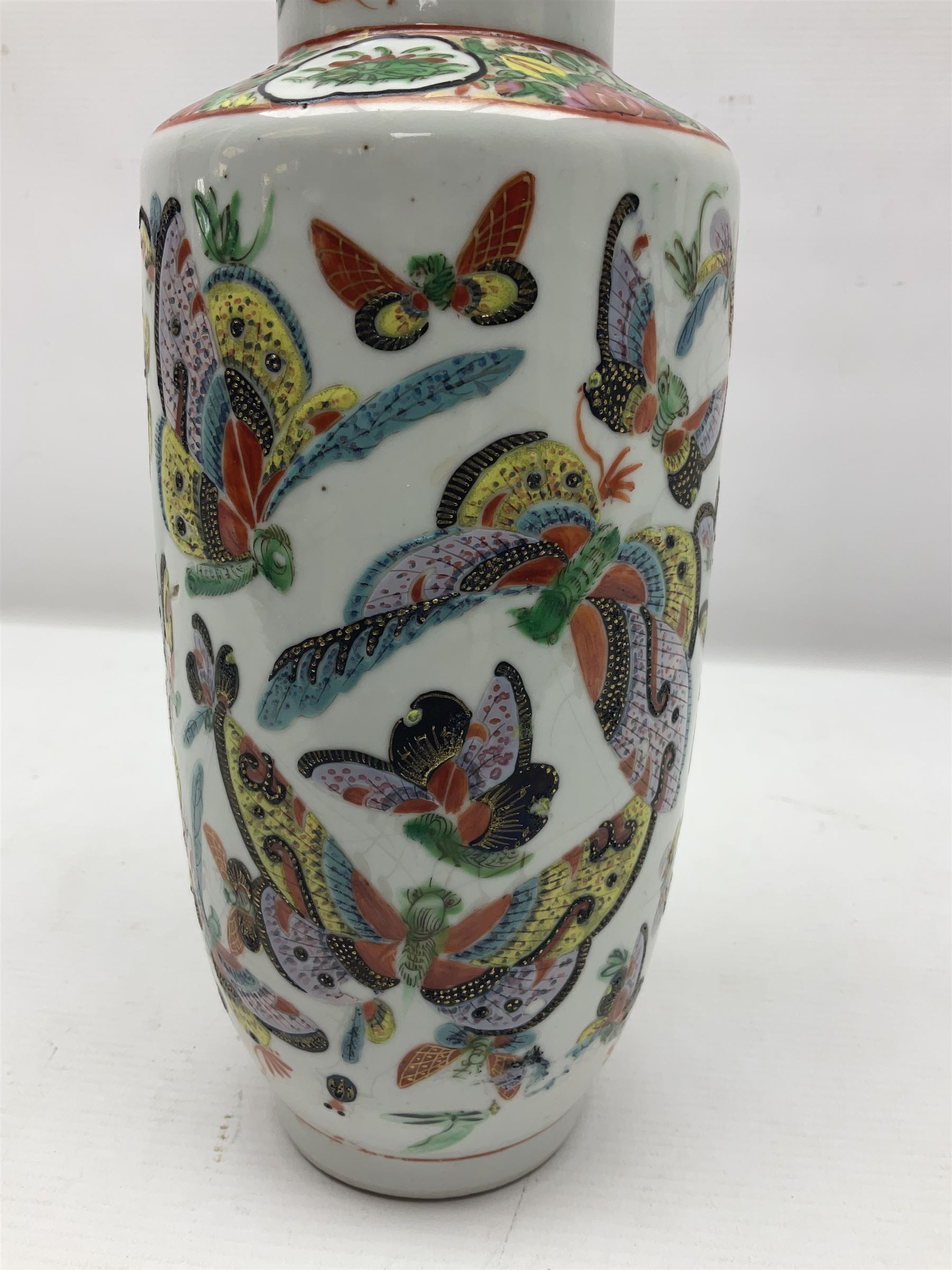 19th century Chinese Canton vase of slender baluster form, decorated with butterflies and floral panel to the neck, H30cm