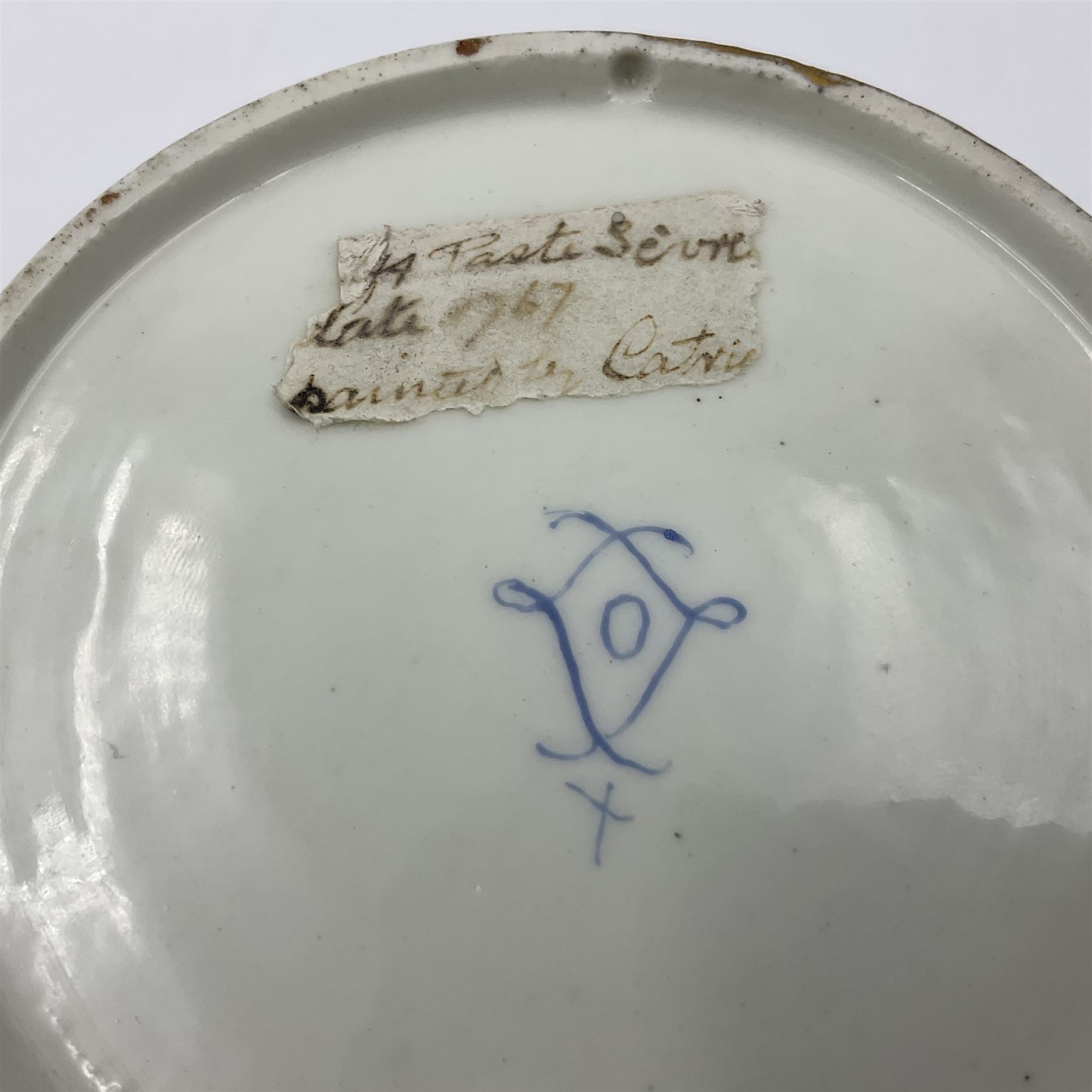 Sèvres soft paste porcelain coffee can and saucer with date code for 1767, painted with floral and laurel leaf garlands within blue scalloped and gilt borders, interlaced LL monogram enclosing the date letter O above painters mark for Catrice, coffee can H7.5cm, saucer D15cm