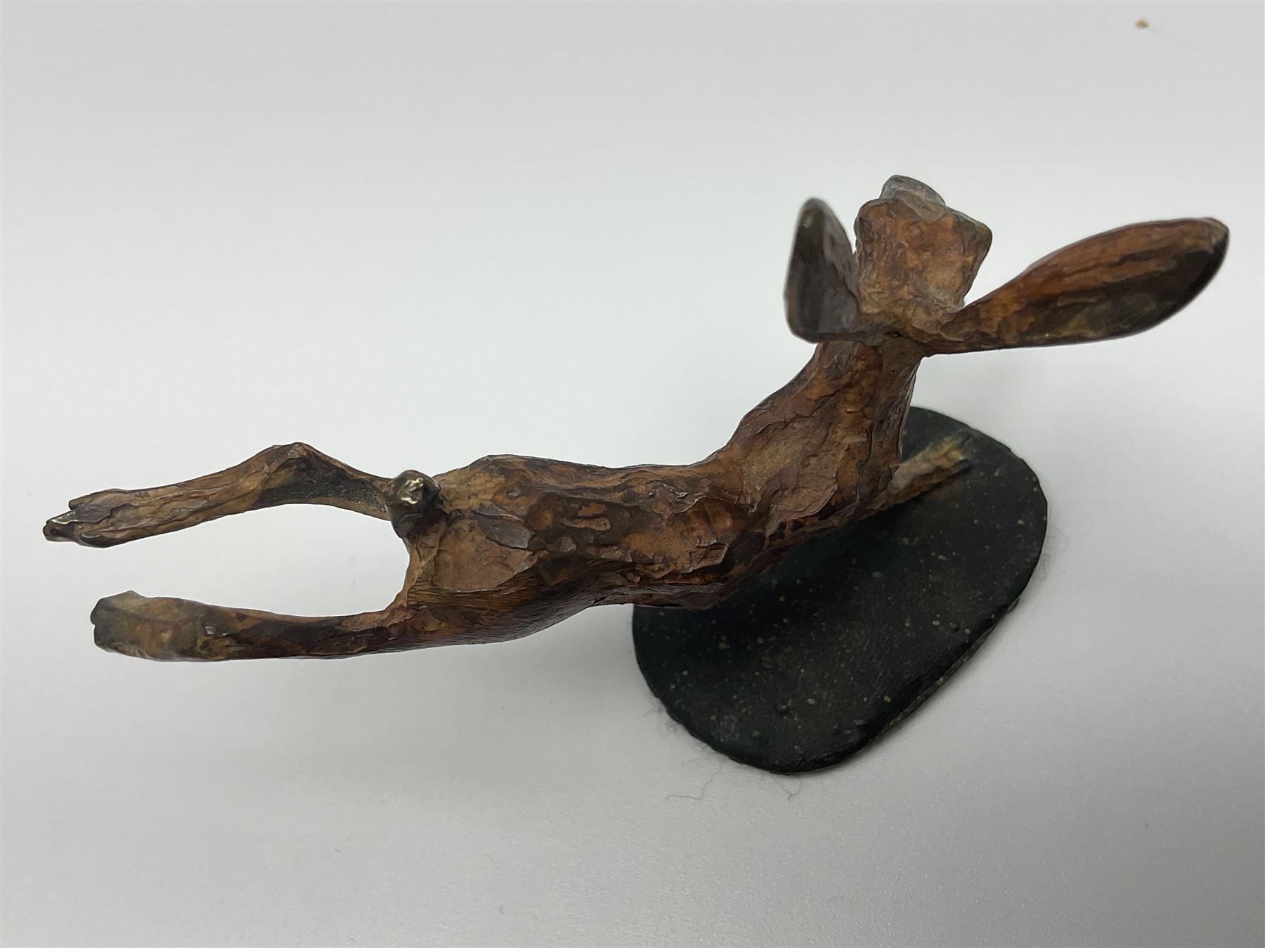 Michael Storey (British 1948-): 'Running Hare', bronze of a hare, H7cm, L10cm 