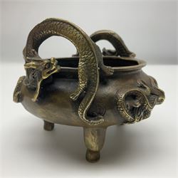 Chinese cast brass censer, with applied dragon twin handles and decoration, raised upon three feet with character mark beneath, D12cm H9.5cm