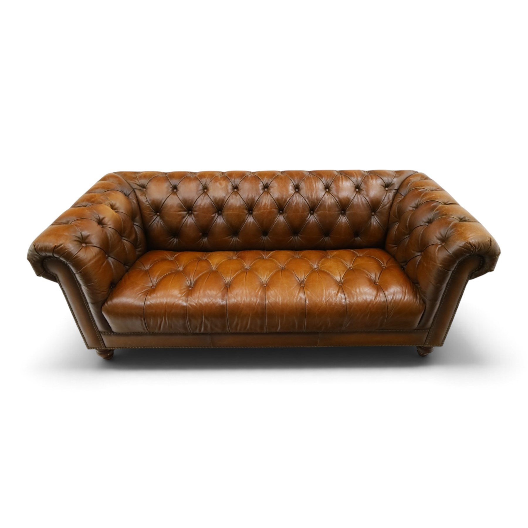 Barker and Stonehouse - traditional shape 'Ullswater' three seater Chesterfield club sofa, rolled back and arms upholstered in buttoned tan leather with studwork, raised on turned feet