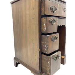 Georgian walnut kneehole desk, moulded rectangular top with book-matched veneers within crossbanding, fitted with slide over one long drawer, frieze drawer, six small drawers and recessed cupboard, raised on bracket feet