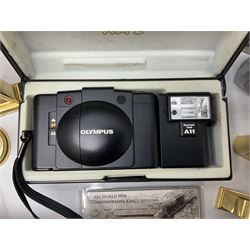 Kundo quartz clock, miniature brass clocks, two barometers, Sony digital camera, Nokia phone, Monarch Remington typewriter, commemorative Shilling etc