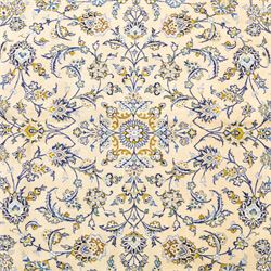 Central Persian Kashan hand-knotted carpet, pale ivory ground, decorated with an all-over scrolling floral design of palmettes rosettes, and leafy vine work enclosed by a wide floral border and multiple guard borders in tones of soft blues, sage green, muted gold, and ivory, with cotton fringe ends