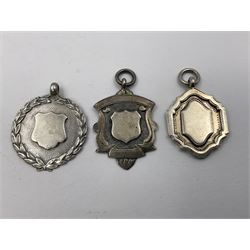 Ten early 20th century silver cartouche fobs, to include a Yorkshire Rose example, all hallmarked with various dates and makers
