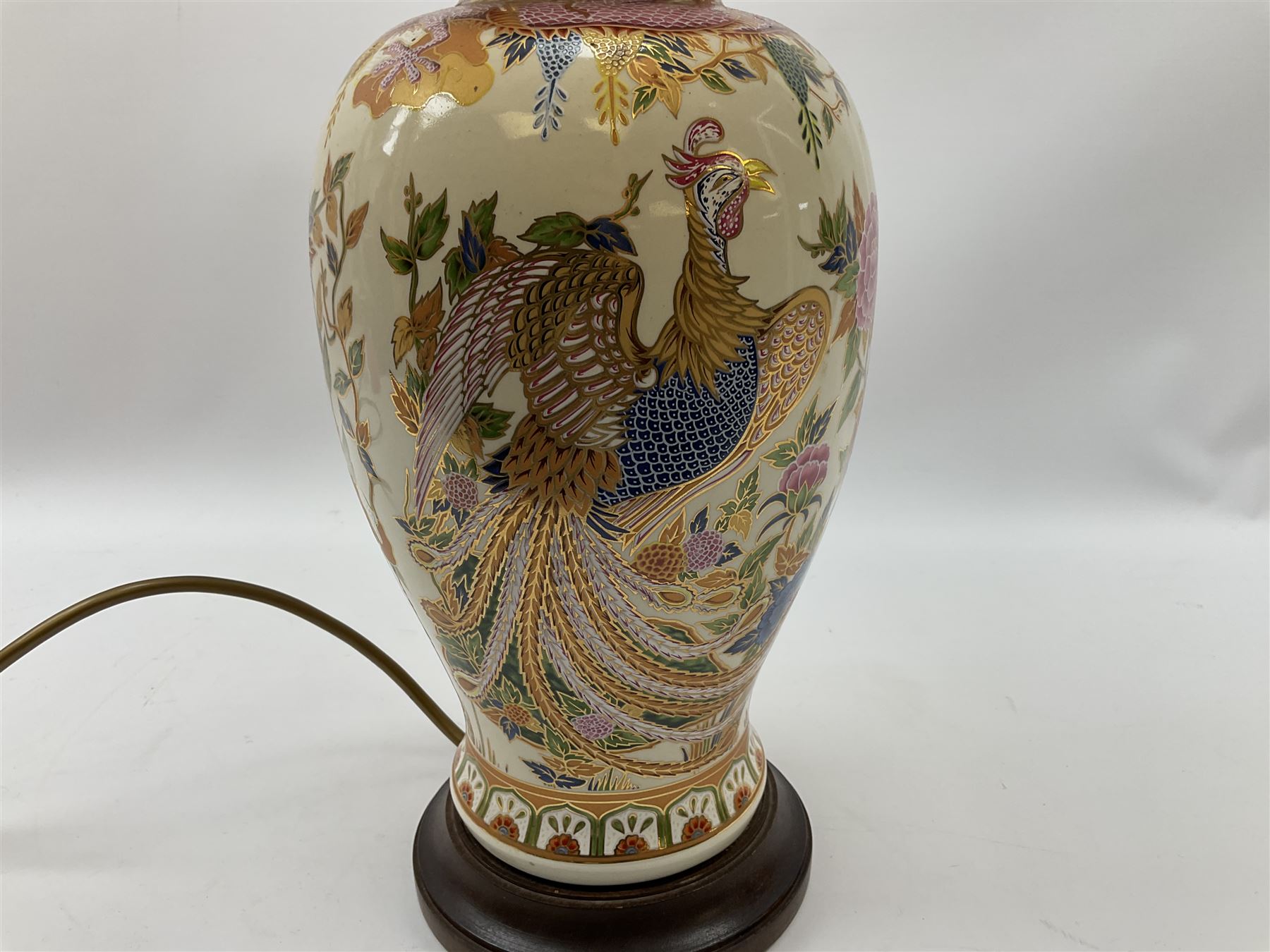Table lamp of baluster form, decorated in the Oriental style with phoenix and dragon amidst blossoming flowers, with plated cream fabric shade, lamp base not including fixtures H35cm