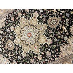 Fine Persian Tabriz, overall geometric design, central medallion on black ground field, decorated with interlace foliate and stylised foliate, three band border with repeating design