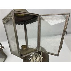 Pair of metal coach lanterns, converted into wall lights, each with eagle finial and four clear glass panels, H39cm 
