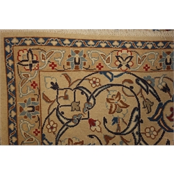  Persian Nain beige and blue ground rug, central medallion, interlaced floral field, 305cm x 200cm  