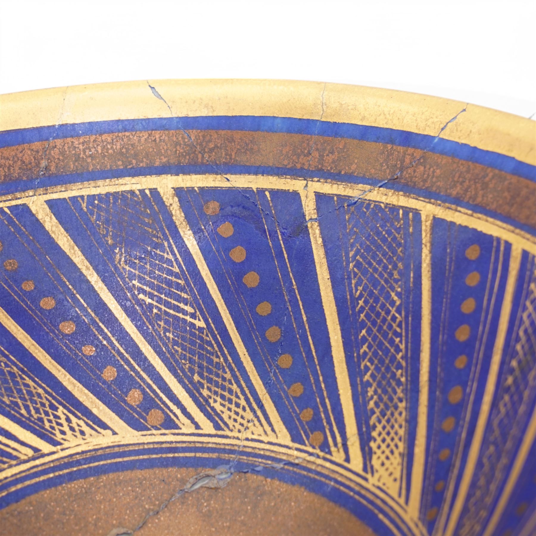 Mary Rich (1940-2022); three studio pottery footed bowls, in blue with gilt geometric decoration, impressed potters seal to base, largest D28cm (3)