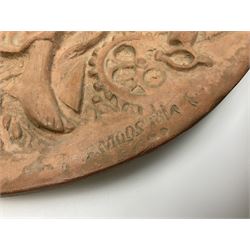 Pair of 19th century classical terracotta relief wall plaques depicting the goddess Hygeia and another goddess, seated holding an ewer, each of oval form, indistinctly signed, each stamped Ferreira verso, H42cm, W30cm