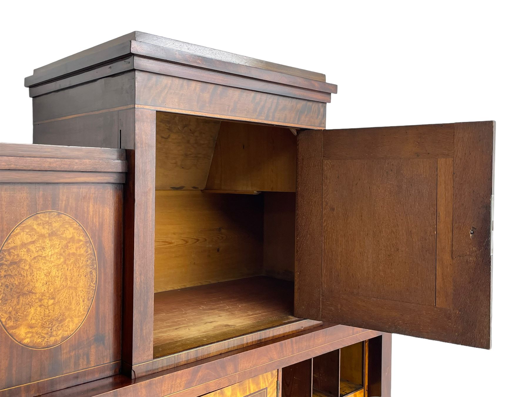 Early to mid-19th century figured mahogany Continental secrétaire à abattant, stepped top fitted with single cupboard, inlaid with oval figured amboyna panels, the fall front inlaid with shell motif enclosing a satinwood interior fitted with cupboard, drawers, and pigeon holes, three long drawers below, on square tapering feet