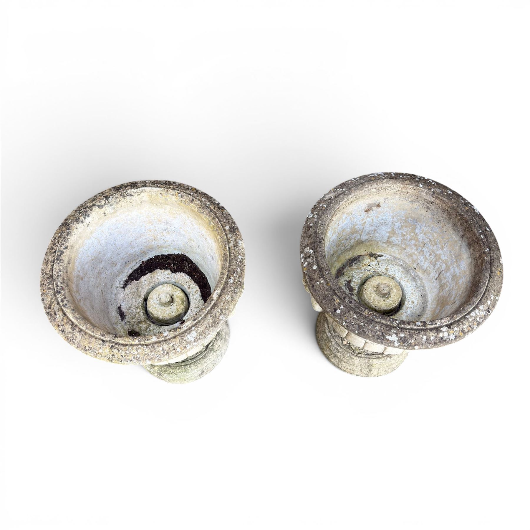 Pair of classic design cast stone garden urns, circular bowl detailed with lion mask loop handles