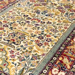 Two Central Persian rugs, ivory ground with a symmetrical foliate and floral design around a shaped cartouche medallion with a red floral and bird motif border with contrasting guard stripes, 142x76cm, Central Persian Kashan rug, crimson central field with a floral and foliate design with a stylized rosette medallion incorporating palmettes and scrolling vine work, enclosed by a dark navy border and multiple guard stripes, 117x68cm, (2)