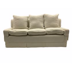 Three seat sofa upholstered in natural white linen, feather cushions