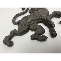 Pair of Victorian cast iron fire dogs, modelled as a lion and unicorn, H27cm