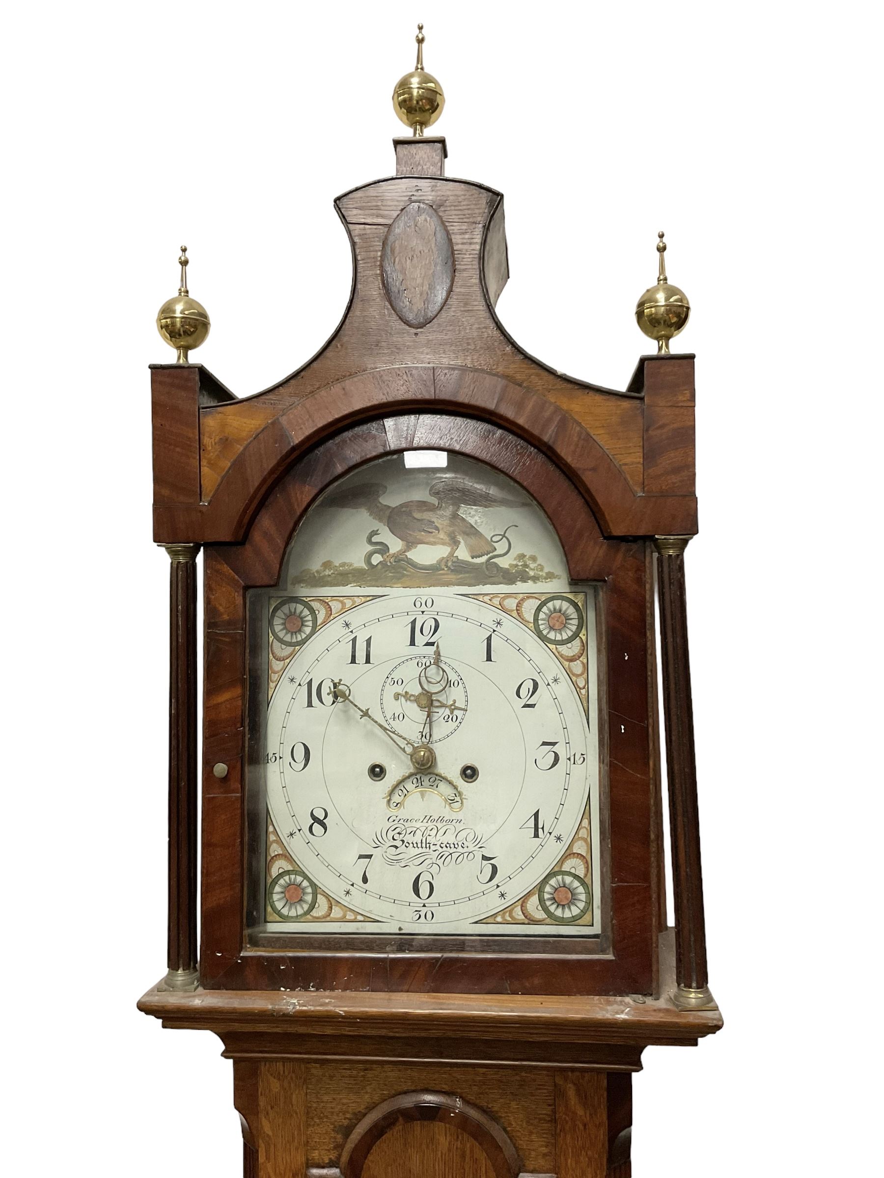 Grace Holborn of South Cave (Nr Hull Yorks.) -  Oak and mahogany 8-day longcase clock, c1820, with a pagoda topped pediment with inlay and three ball and spire finials, break arch painted dial flanked by two reeded pilasters with brass capitals, trunk with canted corners and a full length break arch door, square plinth on bracket feet, dial with upright Arabic numerals and geometric painted spandrels, depiction of an eagle and a snake to the arch,  with a seconds dial and calendar aperture, brass hands and seconds pointer, rack striking recoil anchor weight driven movement, striking the hours on a bell. With weights and pendulum.
Grace Holborn was most probably the widow of Charles William Holborn who was a clockmaker in South Cave 1759-1811.