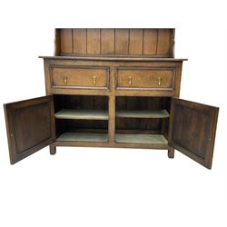 Georgian style oak dresser and rack, fitted with two drawers and two cupboards, carved diamond detail