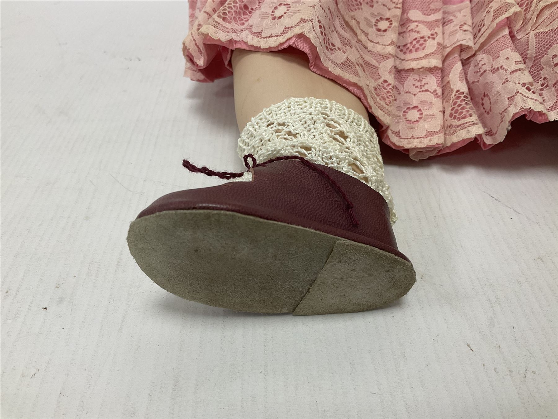 Reproduction Simon & Halbig bisque head doll with applied hair and jointed limbs; marked Simon & Halbig 117, H58cm