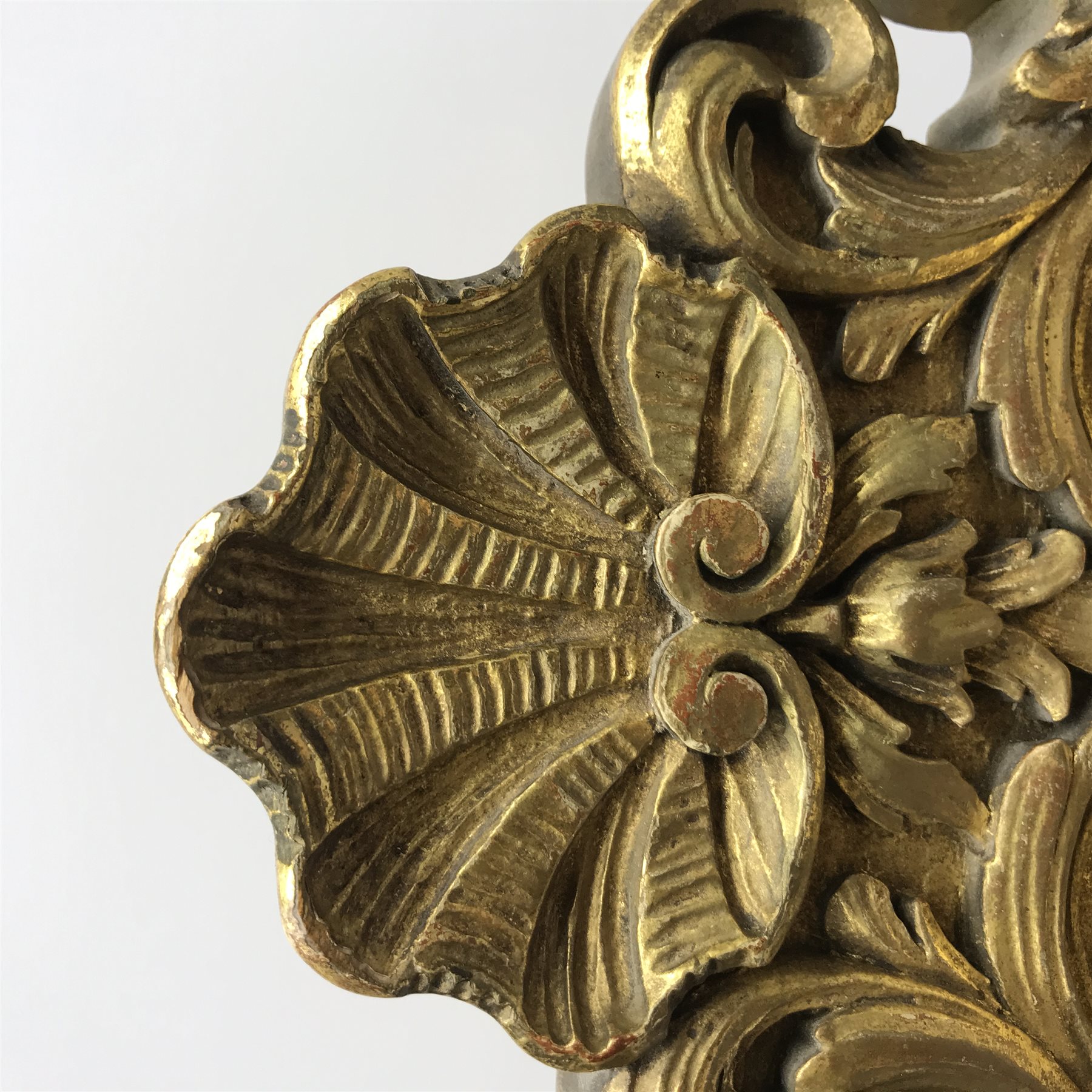 20th century French clock by Planchon Paris, decorative gilt case with shell pediment set on scrolled leafage, circular porcelain segmented dial with Roman and Arabic numerals, bevel glazed front and sides with mirrored interior, acanthus carved feet with scrolled terminals, shell to apron to match, eight day movement striking the hours and half on bell, sunburst and mask cast pendulum, with key, W36cm, H59cm, D21cm