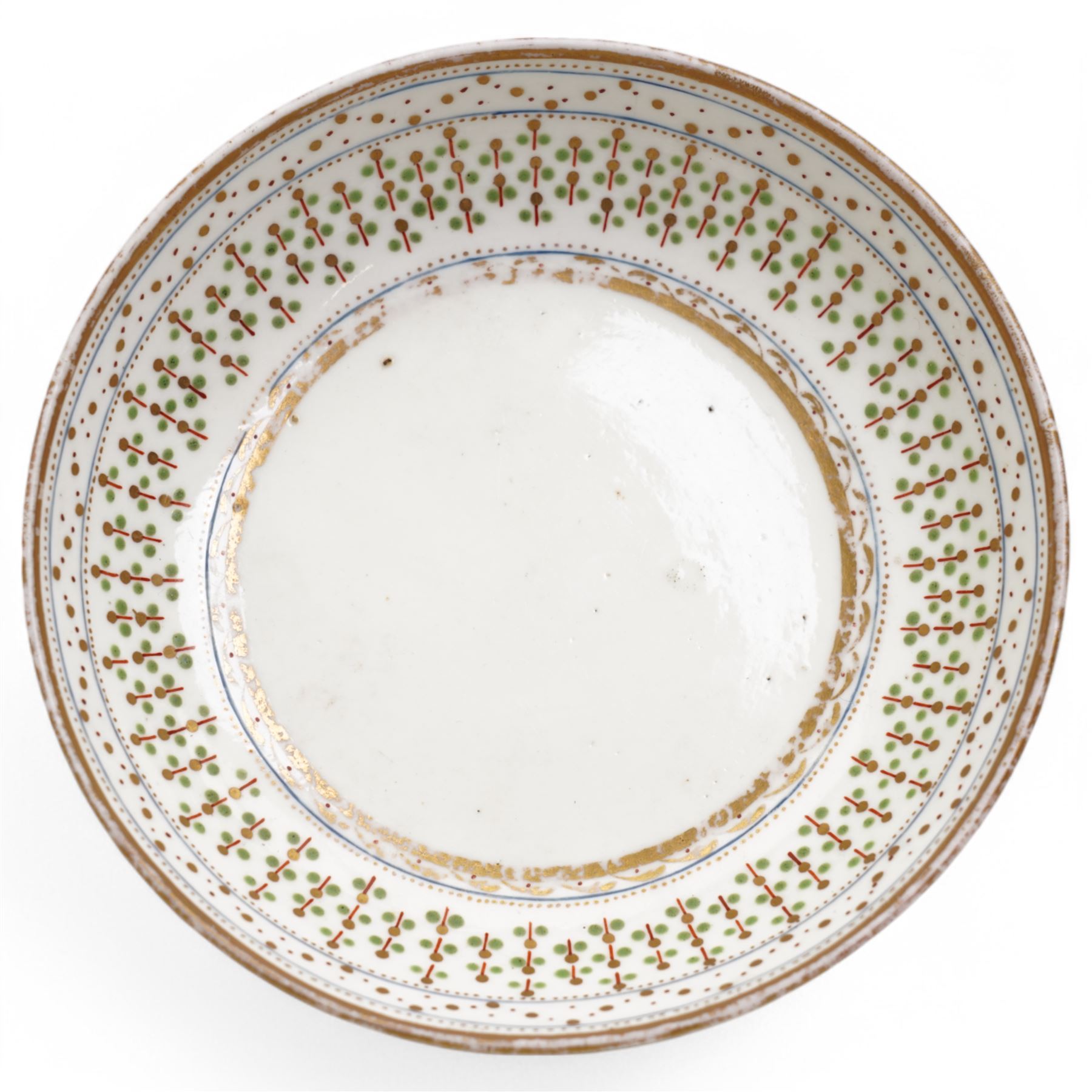 Pinxton porcelain trio, pattern no.193, comprising coffee can, teacup and saucer, decorated with green and gilt stylised sprigs and red and gilt dot borders, teacup with painted marks to base (3)