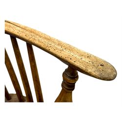 19th century provincial elm and beech Windsor armchair, shaped cresting rail over stick back with pierced and shaped splat, the dished seat on turned supports united by turned stretchers 