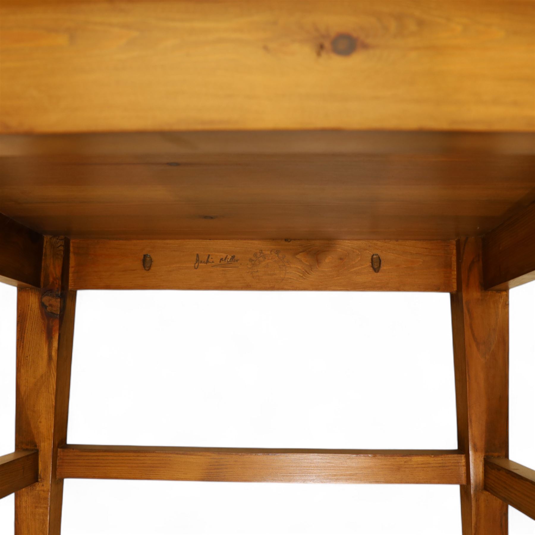 Pair of 20th century full-size pine Orkney chairs, high-back armchairs of traditional design, pegged and wedged construction, wrap-around backrest and sides, above scrolled out-swept arms and solid rounded pine seat, raised on square tapering legs united by stretchers, hand-signed ‘Jackie Miller’ and stamped ‘Orkney’
