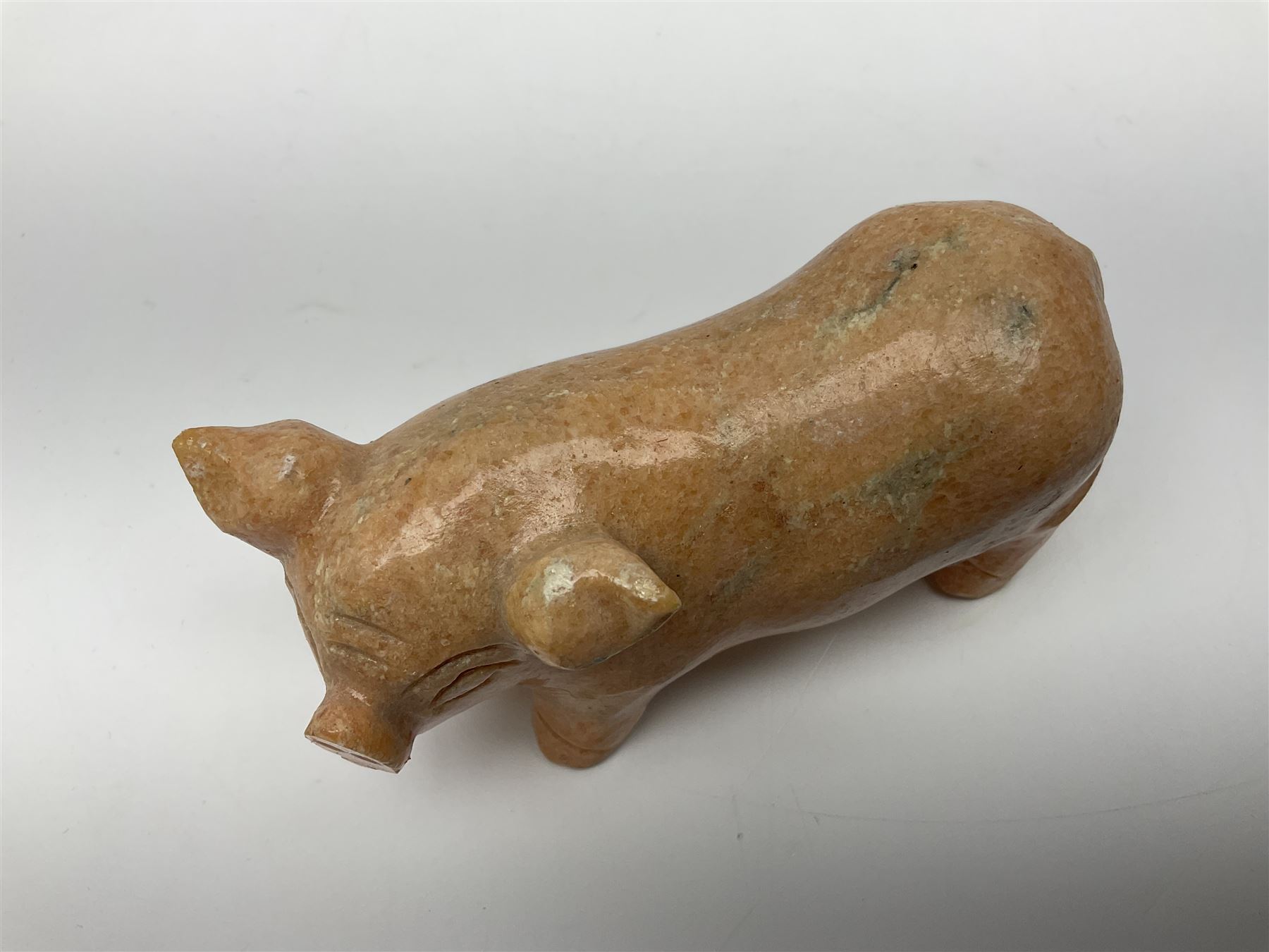 Carved calcite figure in the form of a pig, H6cm