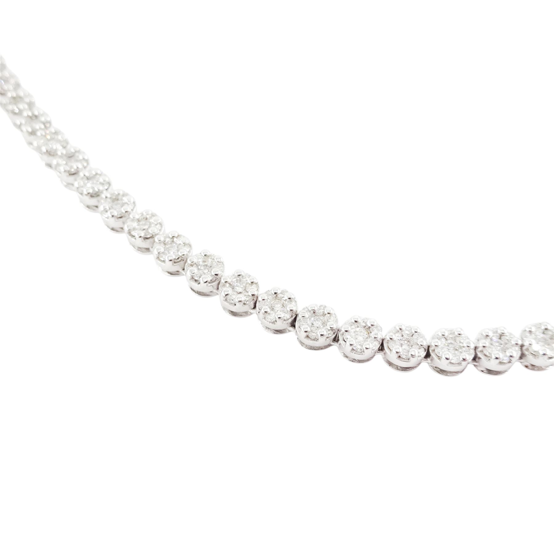 18ct gold diamond necklace, one hundred fourteen clusters, each set with seven round brilliant cut diamonds, hallmarked, total diamond weight 5.00 carat, boxed with certificate
