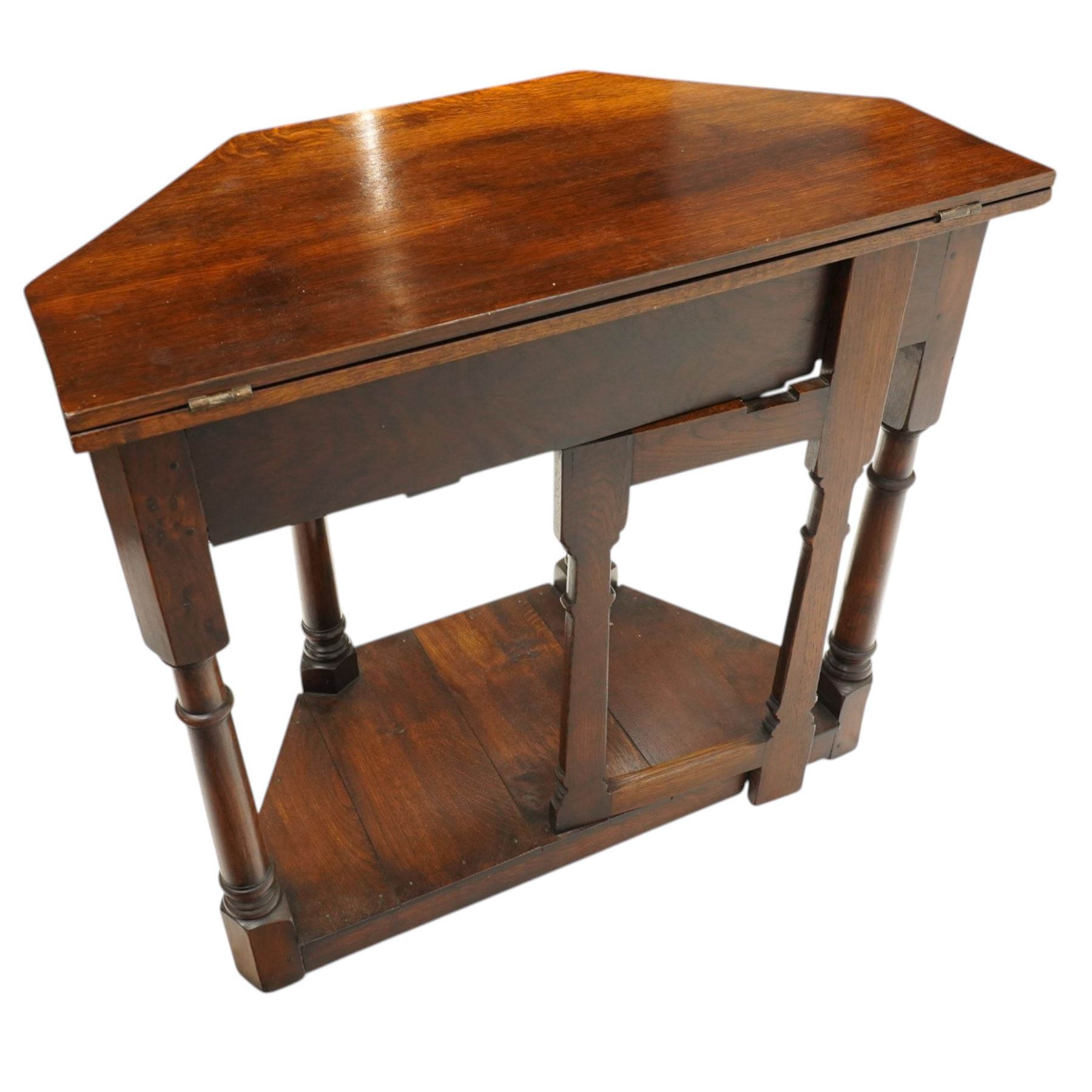 Gothic Revival oak fold-over console table, of octagonal form when unfolded, carved frieze with full length undertier 