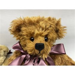 Group of five teddy bears comprising ‘George’ a unique pellet filled bear with glass eyes and velvet paws H38cm, and ‘Abbey’ a luxury German plush with wobble head and glass eyes no.5/10 H24cm, both with Teddies from Bearyland labels; along with two light blonde mohair H. M. Bears and Boyds Bears ‘T. F. Wuzzies’ no. 595140 (5)