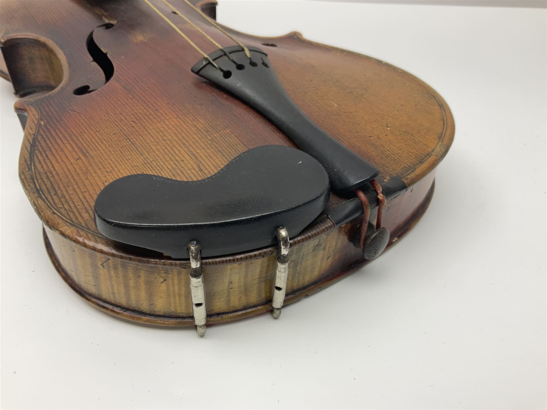 Late 19th century French three-quarter size 'Conservatory' violin with 34cm two-piece maple back and ribs and spruce top, the peg box inscribed 'Conservatory Violin Straduari', bears label 'Antonius Stradiuarius Cremonensis Faciebat Anno 1721' L55.5cm overall; in ebonised wooden 'coffin' case; and Saxony violin c1900 with 36cm two-piece maple back and ribs and spruce top; bears label 'Antonius Stradivarius Cremonensis Faciebat Anno 17**' L59cm overall; in carrying case (2)