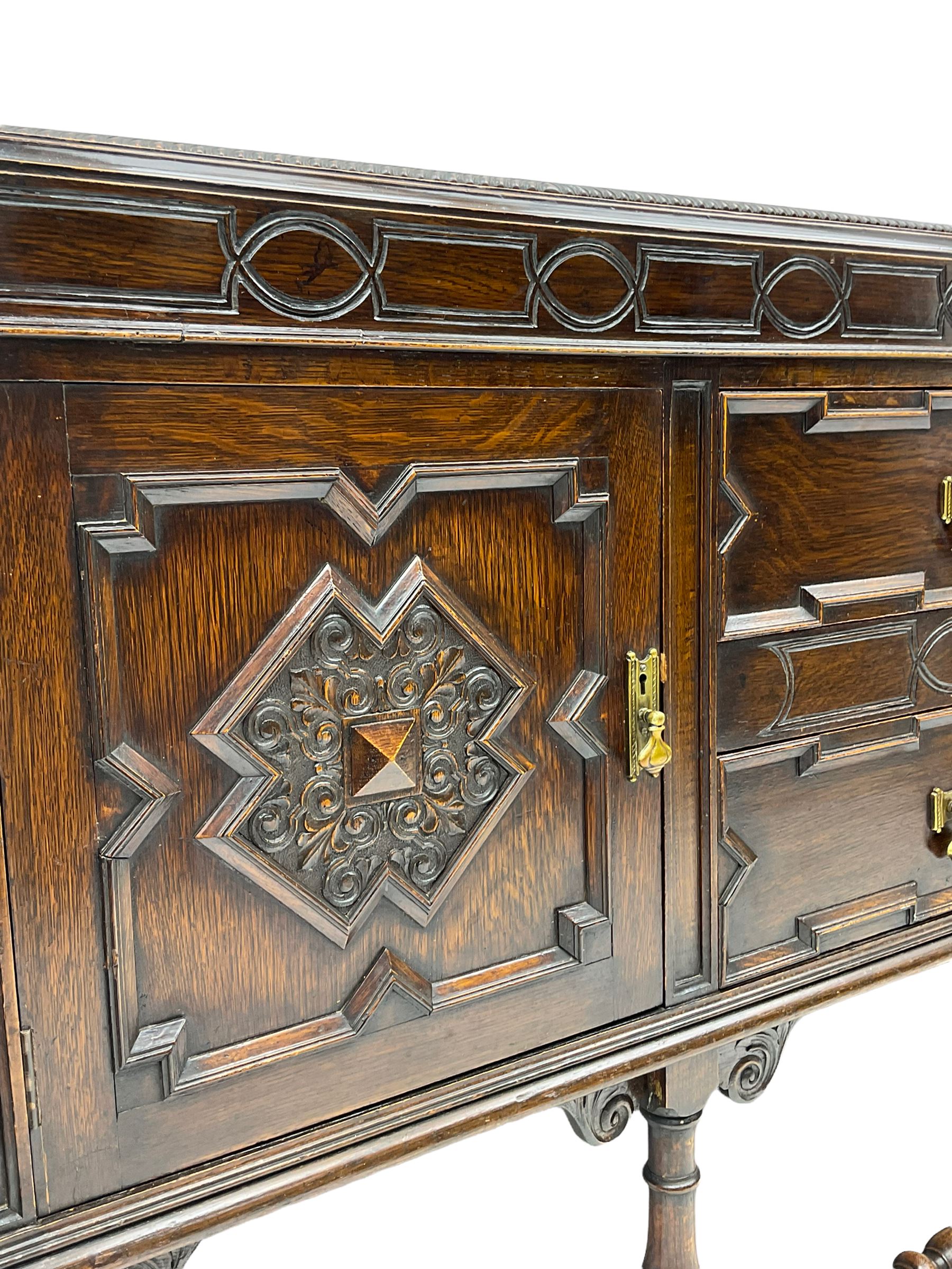 Early 20th century oak sideboard, fitted with two drawers and two cupboards, on turned supports joined by turned stretchers