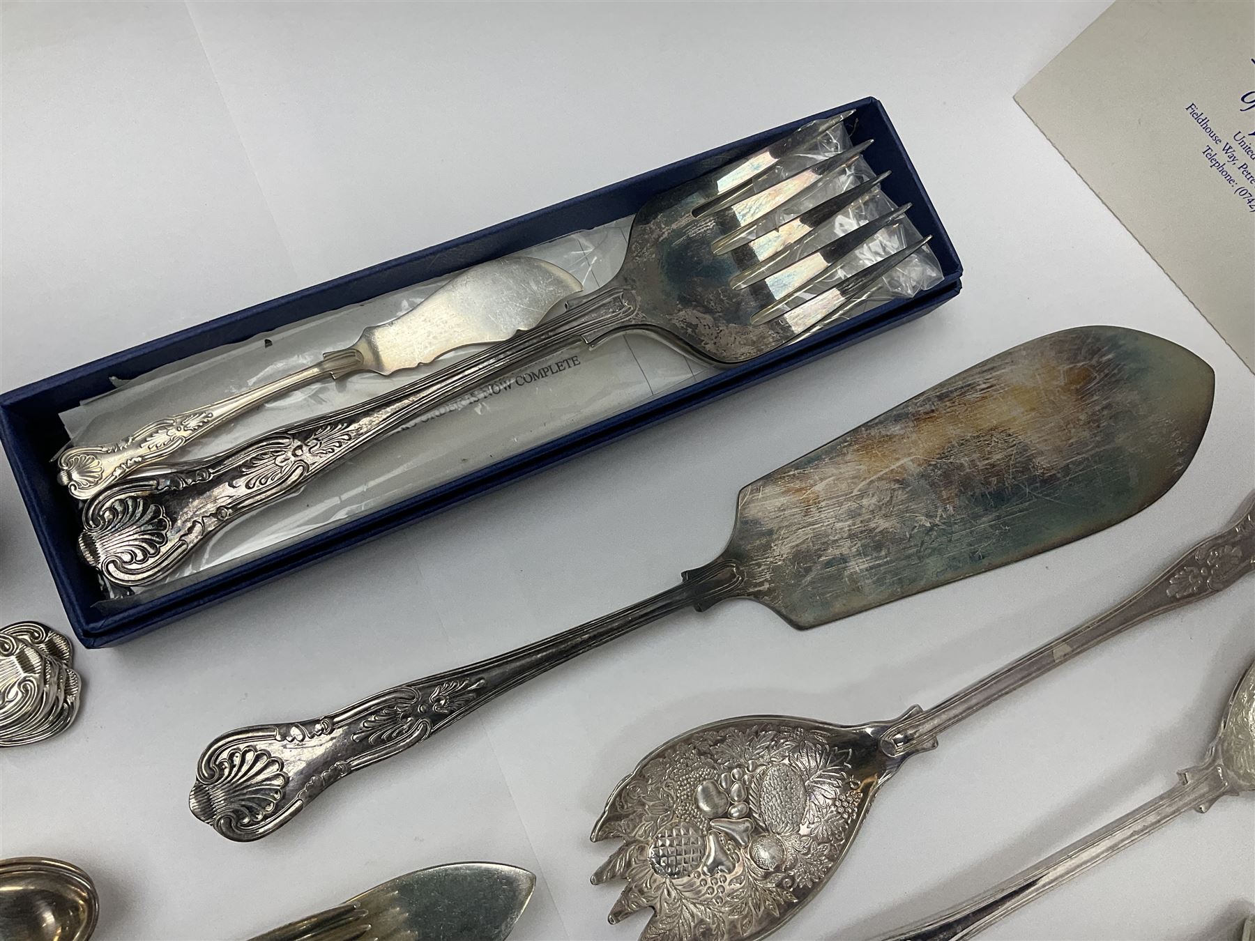 Silver Kings pattern knife, hallmarked Walker & Hall, together with a quantity of silver plated Kings pattern cutlery, including items by Osbourne's and United Cutlers, comprising table knives, table forks, table spoons, serving forks, ladle, berry spoons, teaspoons, dessert forks, cake slice, etc
