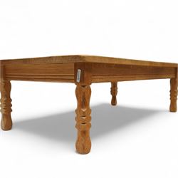 Mid-20th century light oak coffee table, retailed by Danish Homestores, Nottingham, rectangular top with prominent grain figuring, raised on turned supports