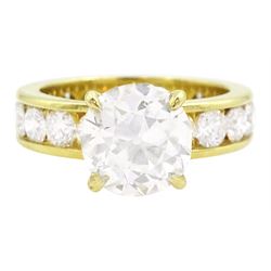  18ct gold single stone old cut diamond ring of approx 2.80 carat, with eighteen round brilliant cut diamond set shank of approx 3.00 carat, total diamond weight approx 5.80 carat