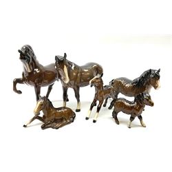 Group of Beswick horses, comprising brown example, first version model no 1549, Shetland Pony model no 1033, Shetland foal model no 1034, Mare facing left, and two Foals. (6). 