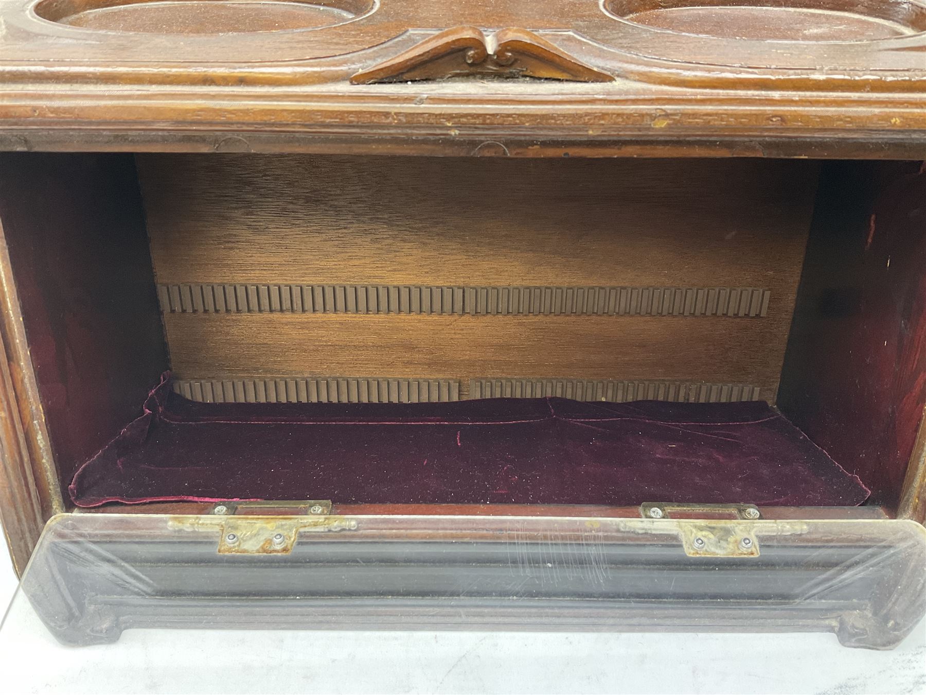 20th century Irish cigar shop display cabinet by Roger Aplin, Dublin, the box with hinged glazed front and decorative scroll top, H30.5cm
