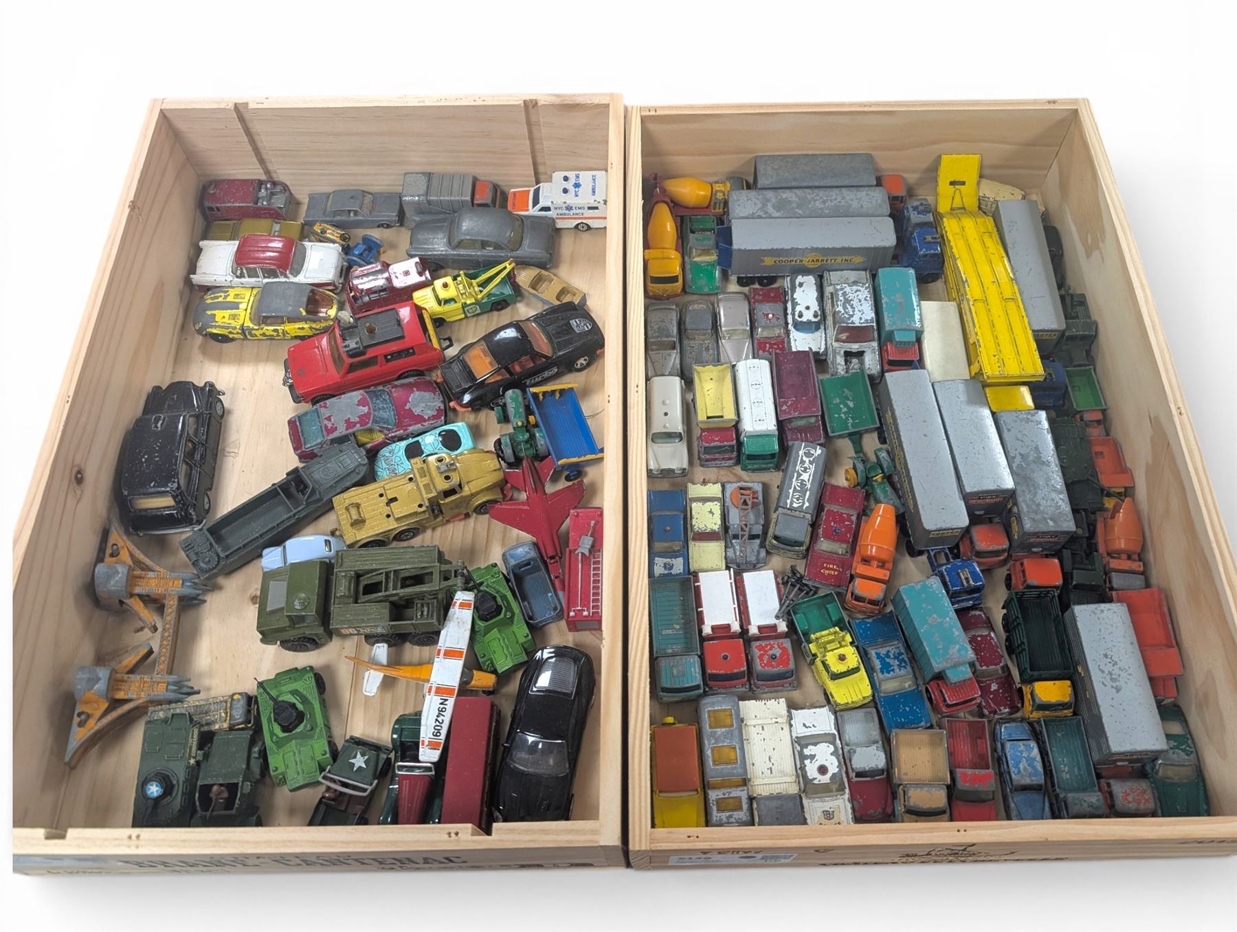 Collection of Matchbox Lesney and similar diecast model vehicles, including buses, lorries, cars, cranes, etc, all loose and playworn, in two wooden wine crates