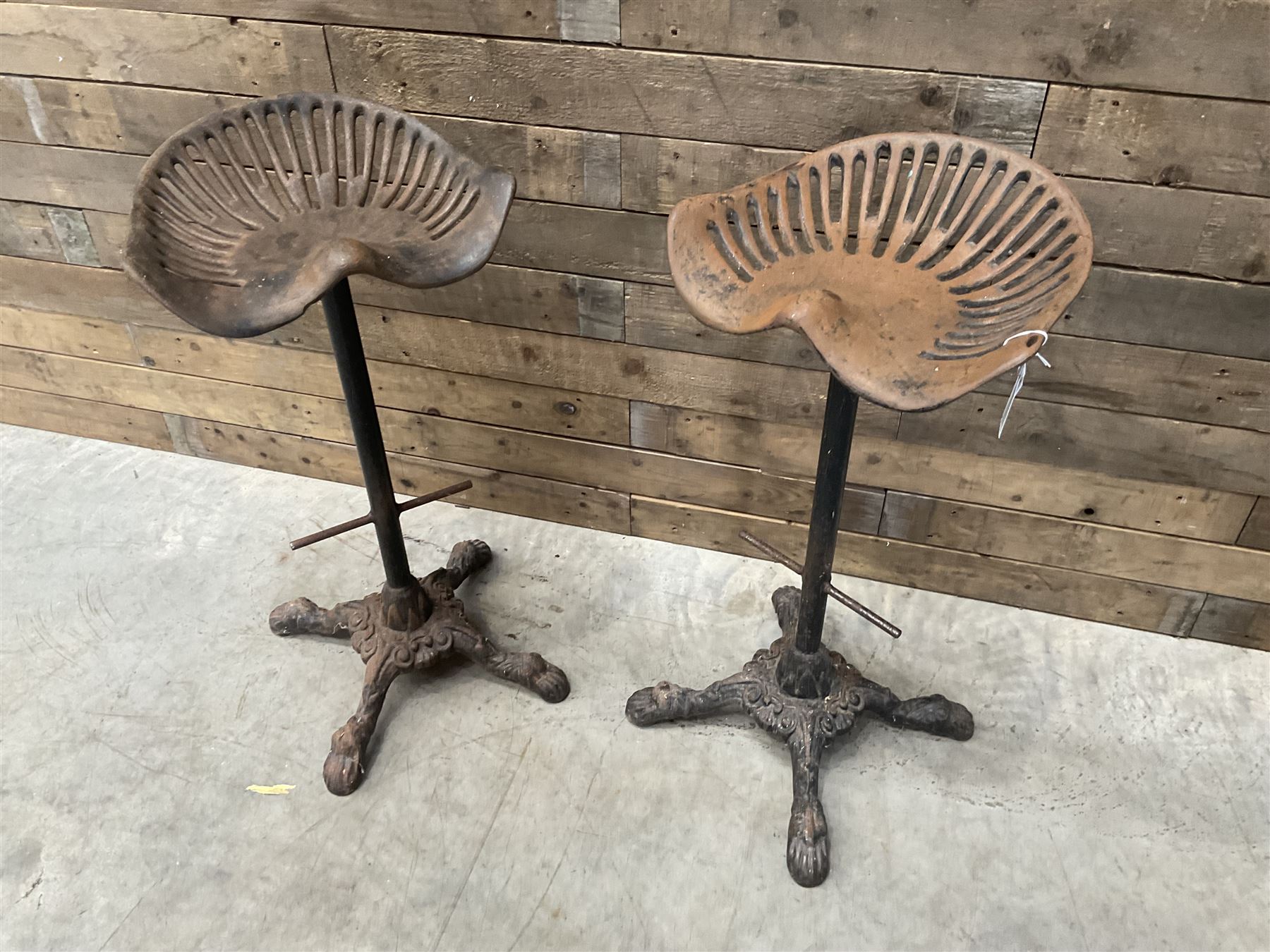 Pair of heavy cast iron tractor seat bar stools