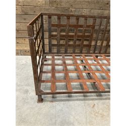 Wrought iron strapwork garden day bed, lattice back and sides