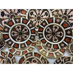 20th century Royal Crown Derby Imari 1128 pattern tea wares, comprising six teacups, five saucers, five side plates, a pair of serving plates, and one other with wavy rim, each with printed marks beneath including various year cyphers, side plates D16cm serving plates each approximately D22cm