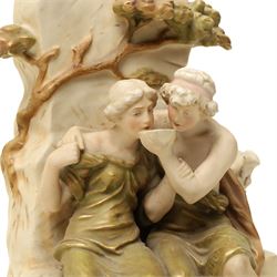 Royal Dux figure of seated male and female figures drinking by a well with gilded decoration H37cm
