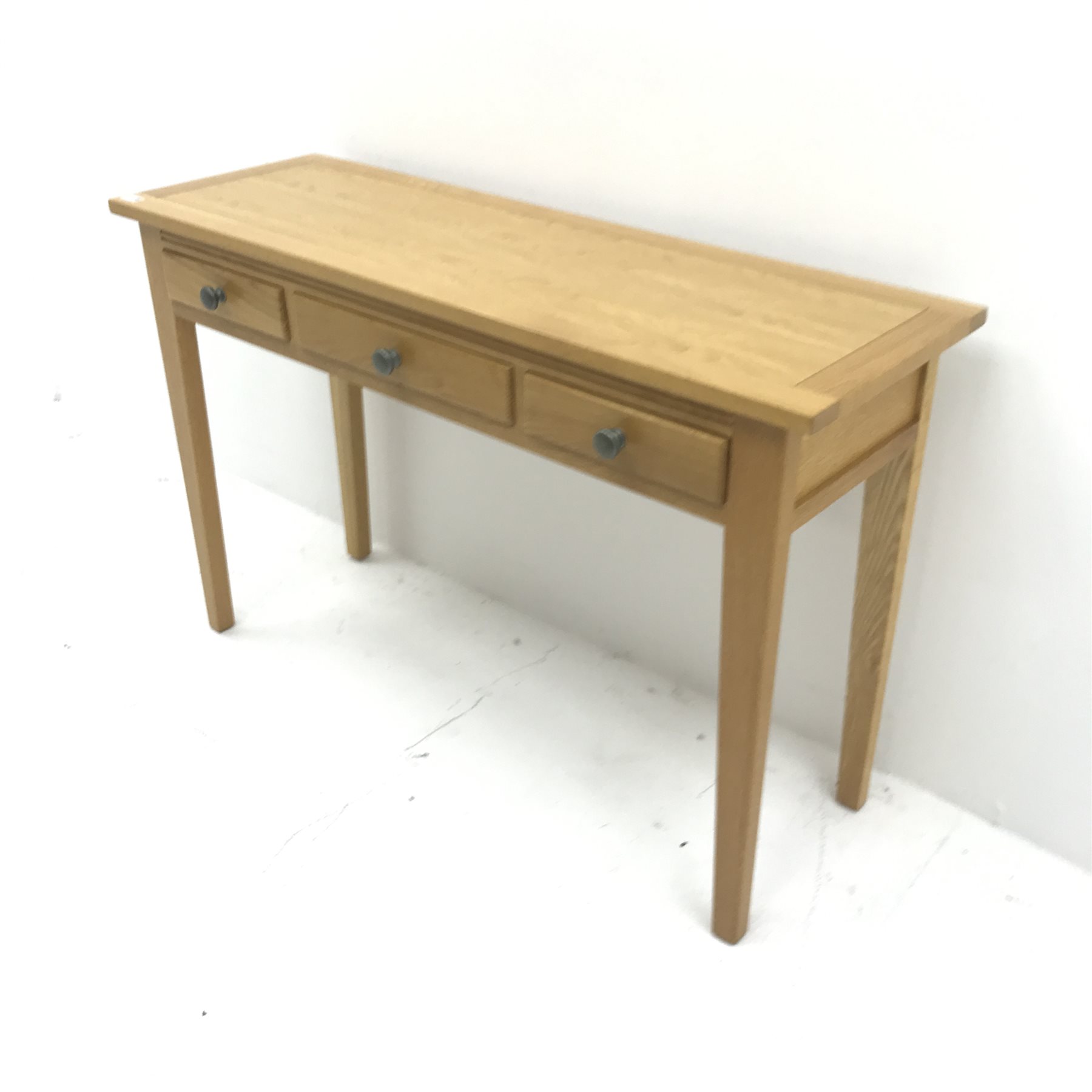 Light oak side table, two short and one long drawers, square tapering